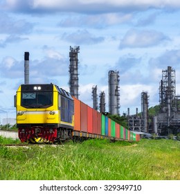 Rail Freight, Containers, Against A Backdrop Of An Oil Refinery.