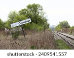 Rail line railway train tracks track. Spring springtime. Rural country countryside. Onondaga sign. Brant County Ontario. Six Nations Indigenous Native historical lands. Brush, trees. 