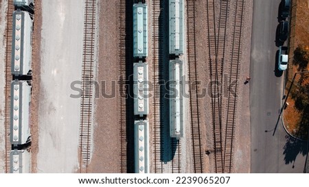 Rail yard aerial view with covered hopper train cars