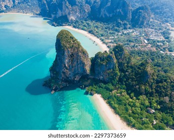 Railay Beach Krabi Thailand, the tropical beach of Railay Krabi, view from a drone of idyllic Railay Beach in Thailand in the evening at susnet with a cloudy sky