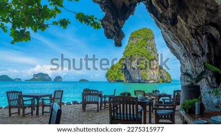 Railay beach Krabi Thailand, tropical beach of Railay Krabi with a restaurant in a cave on the beach Restaurant the Grotto on Railay beach