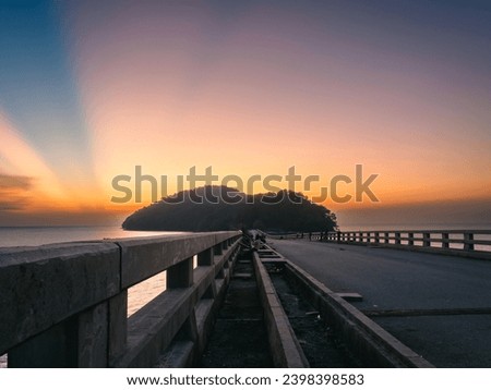 railing of the bridge to Pulau Bunting island during sunset in Yan,Kedah,Malaysia
