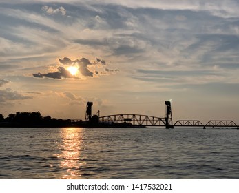 Railroad Bridge Crossing Tennessee River Into Decatur, AL At Sunset