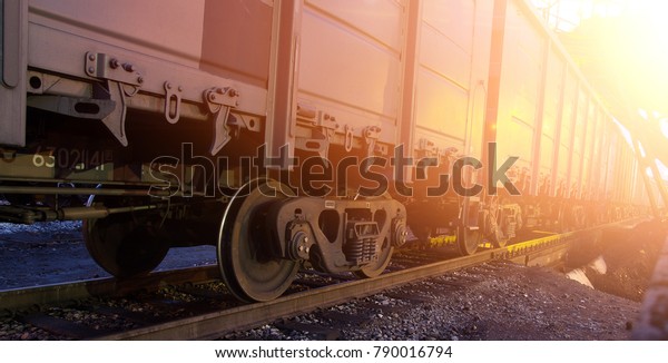 railroad cars loaded with coal,\
the train transports coal. loading of wagons with coal. night\
views.