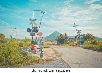 Railroad crossing inThailand, Railroad crossing sign and blue sky