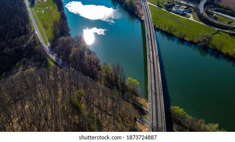 railroad crossing over blue river - Shutterstock ID 1873724887