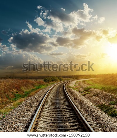railroad goes to horizon in sunset