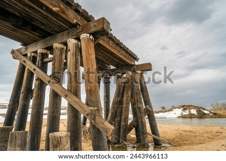 railroad timber trestle destroyed by river flooding - St Vrain Creek near Platteville, Colorado
