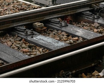 Railroad Track Detail, Closeup, Water On Train Tracks Up Close, Old Metal Rails, Railway In Heavy Rain. Sadness, Melancholy, Gloomy Day Abstract Concept, Nobody, No People