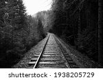 Railroad tracks in black and white.