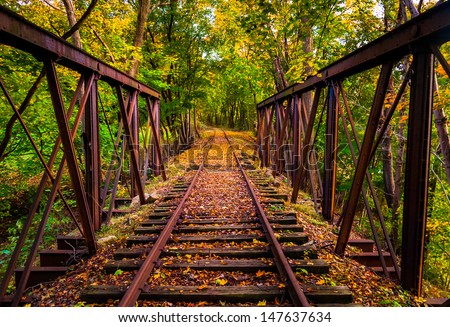 Railroad tracks covered in autumn leaves, near Stewartstown, Pennsylvania.