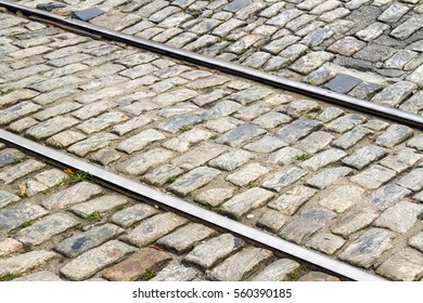 Railroad Tracks Cross Through An Old Stone Street In Savannah, Georgia.