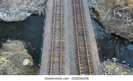 Railroad tracks crossing small creek. - Powered by Shutterstock