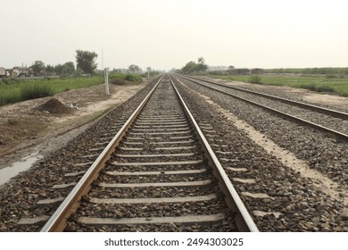 Railroad tracks evening view in Pakistan.The photo shows an empty  railway road. - Powered by Shutterstock