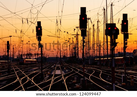Railroad Tracks at a Major Train Station at Sunset.