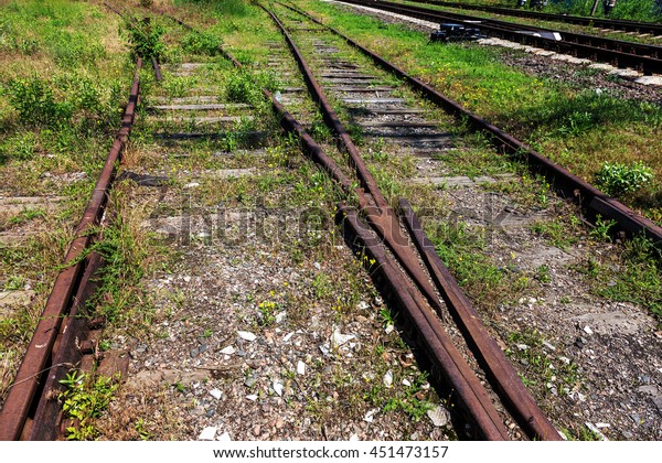 Railroad tracks an old worn and require urgent\
repair of the railway. road rail\
lines