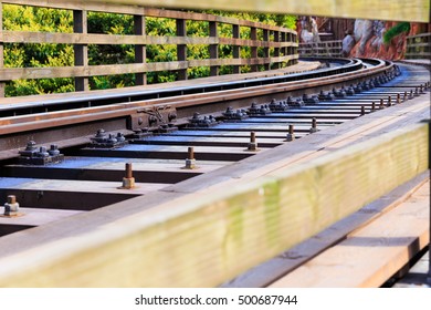 Railroad Tracks An Old Worn Structure. Railway Lines. Merging Railroad Tracks. Railway Translation Movement. Selective Focus With Shallow Depth Of Field