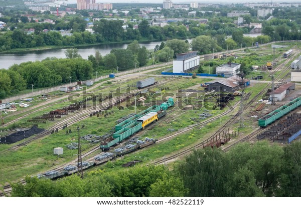 railroad\
tracks on a wagon factory in the\
afternoon\
