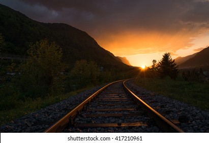 Railroad Tracks In The Setting Sun