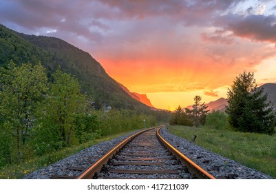 Railroad Tracks In The Setting Sun