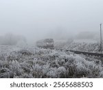 Railroad tracks with train in winter