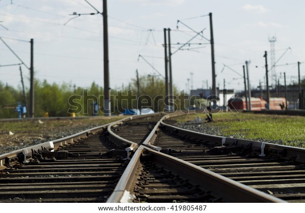 Railroad tracks and
wagons bright sunny
day