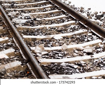 Railroad Tracks In Winter With Snow