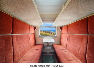 Railroad Train Interior. Inside Of Train - Red Seats; Table And Window