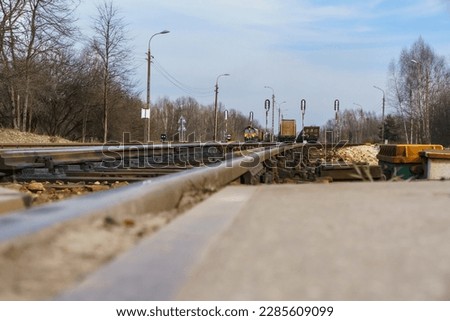 railroad and trains in background