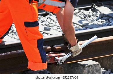 Railroad Worker Fixes Two Single Rails