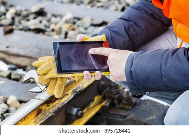 Railroad Worker Using Tablet PC On Railway