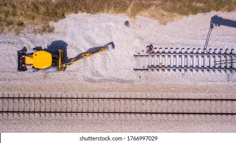 Railroad Workers Repairing A Broken Track. Repairing Railway. Rail Tracks Maintenance Process.