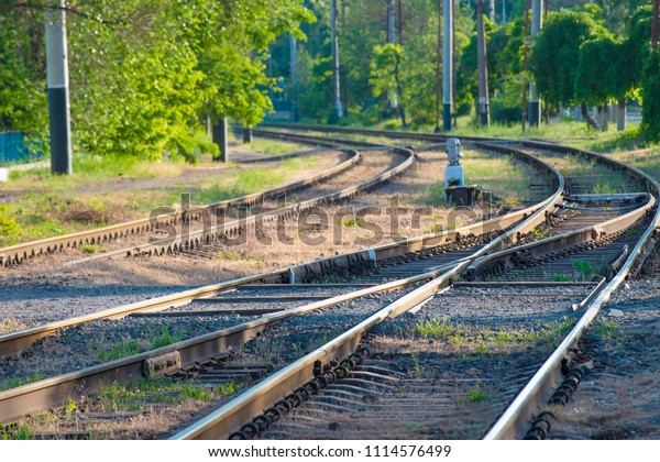 The rails and the arrow for the railway, the fork\
of the road.
