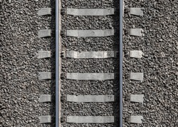 Railway Background Texture. Steel Rails Mounted On Gray Concrete Sleepers. Industrial Transportation Photo Pattern