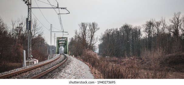 Railway Bridge With Forest And Electric Lines