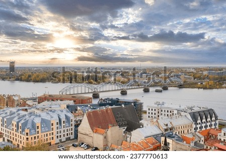 Railway bridge and old town in Riga, Latvia during sunset