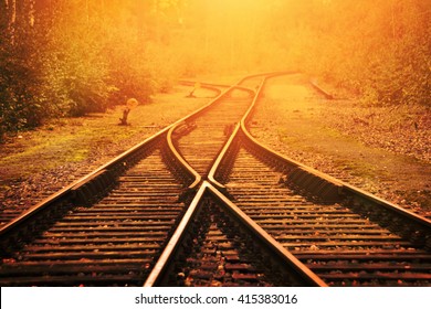 Railway Crossroad In The Evening Sun.