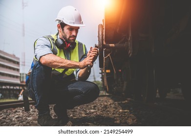 Railway Engineer Caucasian Man Use Wrench Repair Train Wheel.