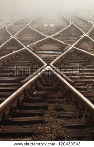 Railway in fog on station, outdoor landscape