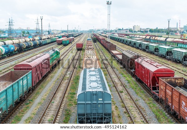 Railway freight cars are at the car-repair factory.\
Top view.