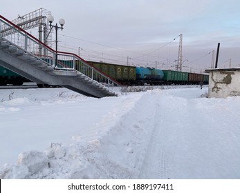 Railway, Freight Train, Train, Overhead Pedestrian Crossing.  Russia, Altai Territory, January 7, 2021