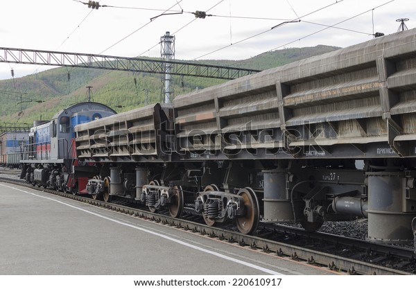 Railway\
freight train at the station. Irkutsk\
region