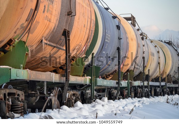 Railway freight train. Tanks for oil and gas.\
Winter. Russia