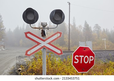 Railway level crossing, semaphore, stop sign, road intersection