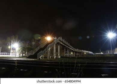 Railway and light lanterns in a summer night - Shutterstock ID 654804994