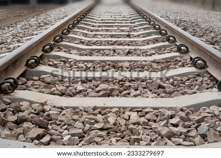 Railway Lines Closeup, Train Tracks with Track Ballast Stones, Metal Rails, Old Railway Track on Blurred Background, Selective Focus