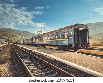 Railway Locomotive. Front View. Old Style Diesel Vehicle. Front View Of Powerful Diesel Locomotive On Railroad. Train At The Railway Station. Suburban Electric Train In Countryside Mountain Stop