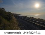 Railway at pacific coast at sunrise