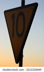 Railway Sign On A Bridge During Sunrise.