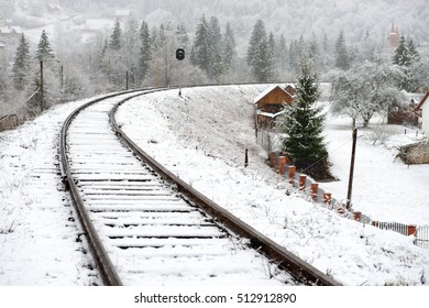 Railway in snow. Winter landscape with empty rail tracks - Powered by Shutterstock